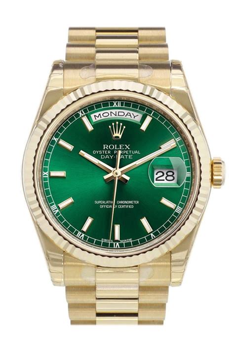 gold rolex with green face